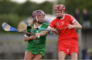 3 July 2021; Roisin Ambrose of Limerick in action against Katrina Mackey of Cork during the Munster Senior Camogie Final match between Cork and Limerick at Drom & Inch GAA in Tipperary. Photo by Matt Browne/Sportsfile