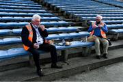 3 July 2021; 'Maors' Mick Mackey, left, and Mattie Finnerty, from Cashel, enjoy a spot of lunch before taking their posts in  advance of the Munster GAA Hurling Senior Championship Semi-Final match between Cork and Limerick at Semple Stadium in Thurles, Tipperary. Photo by Ray McManus/Sportsfile