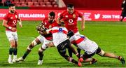 3 July 2021; Courtney Lawes of the British and Irish Lions is tackled by Sibusiso Sangweni and Ruben Schoeman of Sigma Lions during the 2021 British and Irish Lions tour match between Sigma Lions and The British and Irish Lions at Emirates Airline Park in Johannesburg, South Africa. Photo by Sydney Seshibedi/Sportsfile