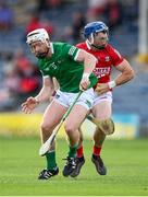 3 July 2021; Sean O'Donoghue of Cork is tackled by Cian Lynch of Limerick during the Munster GAA Hurling Senior Championship Semi-Final match between Cork and Limerick at Semple Stadium in Thurles, Tipperary. Photo by Stephen McCarthy/Sportsfile