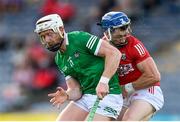 3 July 2021; Sean O'Donoghue of Cork is tackled by Cian Lynch of Limerick during the Munster GAA Hurling Senior Championship Semi-Final match between Cork and Limerick at Semple Stadium in Thurles, Tipperary. Photo by Stephen McCarthy/Sportsfile