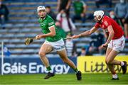 3 July 2021; Kyle Hayes of Limerick on his way to scoring his side's second goal despite the attention of of Tim O'Mahony of Cork during the Munster GAA Hurling Senior Championship Semi-Final match between Cork and Limerick at Semple Stadium in Thurles, Tipperary. Photo by Stephen McCarthy/Sportsfile