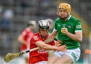 3 July 2021; Richie English of Limerick in action against Ger Millerick of Cork during the Munster GAA Hurling Senior Championship Semi-Final match between Cork and Limerick at Semple Stadium in Thurles, Tipperary. Photo by Stephen McCarthy/Sportsfile