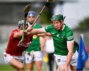 3 July 2021; William O'Donoghue of Limerick in action against Mark Coleman of Cork during the Munster GAA Hurling Senior Championship Semi-Final match between Cork and Limerick at Semple Stadium in Thurles, Tipperary. Photo by Ray McManus/Sportsfile
