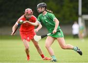 3 July 2021; Judith Mulcahy of Limerick in action against Katrina Mackey of Cork during the Munster Senior Camogie Final match between Cork and Limerick at Drom & Inch GAA in Tipperary. Photo by Matt Browne/Sportsfile