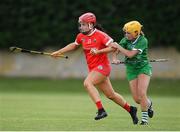 3 July 2021; Fiona Keating of Cork in action against Deborah Murphy of Limerick during the Munster Senior Camogie Final match between Cork and Limerick at Drom & Inch GAA in Tipperary.  Photo by Matt Browne/Sportsfile