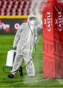 3 July 2021; An official disinfects a post pad during the 2021 British and Irish Lions tour match between Sigma Lions and The British and Irish Lions at Emirates Airline Park in Johannesburg, South Africa. Photo by Sydney Seshibedi/Sportsfile