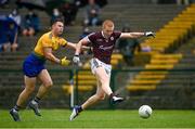 4 July 2021; Peter Cooke of Galway has a shot at goal despite the attention of Niall Daly of Roscommon during the Connacht GAA Football Senior Championship Semi-Final match between Roscommon and Galway at Dr Hyde Park in Roscommon. Photo by Harry Murphy/Sportsfile