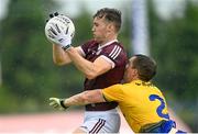 4 July 2021; Robert Finnerty of Galway in action against David Murray of Roscommon during the Connacht GAA Football Senior Championship Semi-Final match between Roscommon and Galway at Dr Hyde Park in Roscommon. Photo by Harry Murphy/Sportsfile
