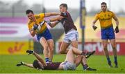 4 July 2021; Tadhg O'Rourke of Roscommon in action against Robert Finnerty, right, and Seán Mulkerrin of Galway during the Connacht GAA Football Senior Championship Semi-Final match between Roscommon and Galway at Dr Hyde Park in Roscommon. Photo by Sam Barnes/Sportsfile