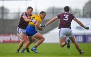 4 July 2021; Enda Smith of Roscommon in action against Matthew Tierney, left, and Seán Mulkerrin of Galway during the Connacht GAA Football Senior Championship Semi-Final match between Roscommon and Galway at Dr Hyde Park in Roscommon. Photo by Sam Barnes/Sportsfile