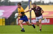 4 July 2021; Sean Mullooly of Roscommon in action against Damien Comer of Galway during the Connacht GAA Football Senior Championship Semi-Final match between Roscommon and Galway at Dr Hyde Park in Roscommon. Photo by Sam Barnes/Sportsfile