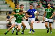 4 July 2021; Michael Quinn of Longford in action against Bryan McMahon and Ethan Devine of Meath during the Leinster GAA Football Senior Championship Quarter-Final match between Meath and Longford at Páirc Tailteann in Navan, Meath. Photo by Seb Daly/Sportsfile