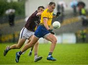4 July 2021; Enda Smith of Roscommon in action against Paul Conroy of Galway during the Connacht GAA Football Senior Championship Semi-Final match between Roscommon and Galway at Dr Hyde Park in Roscommon. Photo by Harry Murphy/Sportsfile