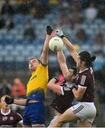 4 July 2021; Enda Smith of Roscommon in action against Seán Mulkerrin and Kieran Molloy of Galway during the Connacht GAA Football Senior Championship Semi-Final match between Roscommon and Galway at Dr Hyde Park in Roscommon. Photo by Harry Murphy/Sportsfile