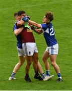 4 July 2021; Denis Corroon of Westmeath is tackled by Evan Carroll, left, and Finbar Crowley of Laois during the Leinster GAA Football Senior Championship Quarter-Final match between Laois and Westmeath at Bord Na Mona O'Connor Park in Tullamore, Offaly. Photo by Eóin Noonan/Sportsfile