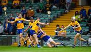 4 July 2021; Cathal Barrett of Tipperary clears under pressure from Ian Galvin of Clare during the Munster GAA Hurling Senior Championship Semi-Final match between Tipperary and Clare at LIT Gaelic Grounds in Limerick. Photo by Ray McManus/Sportsfile