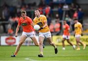 4 July 2021; Dermot McAleese of Antrim in action against Oisin O'Neill of Armagh during the Ulster GAA Football Senior Championship Quarter-Final match between Armagh and Antrim at the Athletic Grounds in Armagh. Photo by David Fitzgerald/Sportsfile