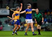 4 July 2021; Dan McCormack of Tipperary signals for a wide ball as David Reidy of Clare celebrates scoring a point in the 11th minute of the Munster GAA Hurling Senior Championship Semi-Final match between Tipperary and Clare at LIT Gaelic Grounds in Limerick. Photo by Ray McManus/Sportsfile