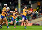 4 July 2021; Ian Galvin of Clare scores a point under pressure from Padraic Maher of Tipperary in the 8th minute of the Munster GAA Hurling Senior Championship Semi-Final match between Tipperary and Clare at LIT Gaelic Grounds in Limerick. Photo by Ray McManus/Sportsfile