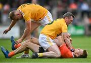 4 July 2021; Rian O'Neill of Armagh in action against James Laverty, centre, and Marc Jordan of Antrim during the Ulster GAA Football Senior Championship Quarter-Final match between Armagh and Antrim at the Athletic Grounds in Armagh. Photo by David Fitzgerald/Sportsfile