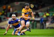 4 July 2021; Ian Galvin of Clare breaks clear of Padraic Maher of Tipperary on his way to score a goal in the sixth minute of the Munster GAA Hurling Senior Championship Semi-Final match between Tipperary and Clare at LIT Gaelic Grounds in Limerick. Photo by Ray McManus/Sportsfile