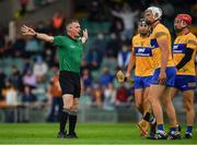 4 July 2021; Cathal Malone, Conor Cleary and John Conlon of Clare look on as referee James Owens awards a penalty to Tipperary during the Munster GAA Hurling Senior Championship Semi-Final match between Tipperary and Clare at LIT Gaelic Grounds in Limerick. Photo by Ray McManus/Sportsfile