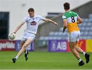 4 July 2021; Aaron Masterson of Kildare passes under pressure from Cathal Mangan of Offaly during the Leinster GAA Football Senior Championship Quarter-Final match between Kildare and Offaly at MW Hire O'Moore Park in Portlaoise, Laois. Photo by Piaras Ó Mídheach/Sportsfile