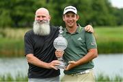 4 July 2021; Lucas Herbert of Australia and his caddie Nick Pugh, left, with the trophy after winning the Dubai Duty Free Irish Open Golf Championship at Mount Juliet Golf Club in Thomastown, Kilkenny. Photo by Ramsey Cardy/Sportsfile