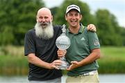 4 July 2021; Lucas Herbert of Australia and his caddie Nick Pugh, left, with the trophy after winning the Dubai Duty Free Irish Open Golf Championship at Mount Juliet Golf Club in Thomastown, Kilkenny. Photo by Ramsey Cardy/Sportsfile