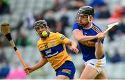 4 July 2021; Dan McCormack of Tipperary in action against David Reidy of Clare during the Munster GAA Hurling Senior Championship Semi-Final match between Tipperary and Clare at LIT Gaelic Grounds in Limerick. Photo by Stephen McCarthy/Sportsfile
