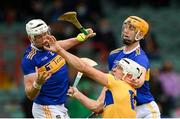 4 July 2021; Aron Shanagher of Clare in action against Padraic Maher, left, and Barry Heffernan of Tipperary during the Munster GAA Hurling Senior Championship Semi-Final match between Tipperary and Clare at LIT Gaelic Grounds in Limerick. Photo by Stephen McCarthy/Sportsfile