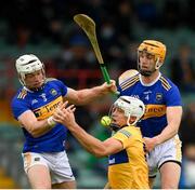 4 July 2021; Aron Shanagher of Clare in action against Padraic Maher, left, and Barry Heffernan of Tipperary during the Munster GAA Hurling Senior Championship Semi-Final match between Tipperary and Clare at LIT Gaelic Grounds in Limerick. Photo by Stephen McCarthy/Sportsfile