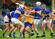 4 July 2021; David Reidy of Clare in action against Seamus Kennedy, left, and Brendan Maher of Tipperary during the Munster GAA Hurling Senior Championship Semi-Final match between Tipperary and Clare at LIT Gaelic Grounds in Limerick. Photo by Stephen McCarthy/Sportsfile