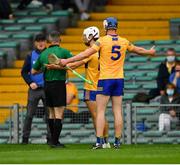 4 July 2021; Diarmuid Ryan of Clare appeals to referee James Owens after he had issued a yellow card to his team mate Aidan McCarthy, 12, during the Munster GAA Hurling Senior Championship Semi-Final match between Tipperary and Clare at LIT Gaelic Grounds in Limerick. Photo by Ray McManus/Sportsfile