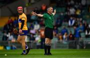 4 July 2021; Referee James Owens indicates a penalty during the Munster GAA Hurling Senior Championship Semi-Final match between Tipperary and Clare at LIT Gaelic Grounds in Limerick. Photo by Ray McManus/Sportsfile