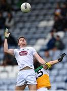 4 July 2021; Kevin Feely of Kildare prepares to catch the ball one-handed ahead of Niall McNamee of Offaly during the Leinster GAA Football Senior Championship Quarter-Final match between Kildare and Offaly at MW Hire O'Moore Park in Portlaoise, Laois. Photo by Piaras Ó Mídheach/Sportsfile
