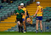 4 July 2021; Diarmuid Ryan of Clare pleads with referee James Owens after he had issued a yellow card to his team-mate Aidan McCarthy, 12, during the Munster GAA Hurling Senior Championship Semi-Final match between Tipperary and Clare at LIT Gaelic Grounds in Limerick. Photo by Ray McManus/Sportsfile