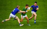 4 July 2021; Fionn Reilly of Meath in action against Patrick Fox, left, and Enda Macken of Longford during the Leinster GAA Football Senior Championship Quarter-Final match between Meath and Longford at Páirc Tailteann in Navan, Meath. Photo by Seb Daly/Sportsfile