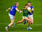 4 July 2021; Fionn Reilly of Meath in action against Patrick Fox, left, and Enda Macken of Longford during the Leinster GAA Football Senior Championship Quarter-Final match between Meath and Longford at Páirc Tailteann in Navan, Meath. Photo by Seb Daly/Sportsfile
