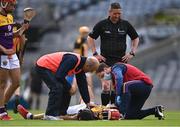 3 July 2021; Lee Chin of Wexford receives medical attention for an injury, as referee Fergal Horgan looks on, during the Leinster GAA Hurling Senior Championship Semi-Final match between Kilkenny and Wexford at Croke Park in Dublin. Photo by Piaras Ó Mídheach/Sportsfile