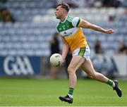 4 July 2021; Jordan Hayes of Offaly prepares to handpass the ball during the Leinster GAA Football Senior Championship Quarter-Final match between Kildare and Offaly at MW Hire O'Moore Park in Portlaoise, Laois. Photo by Piaras Ó Mídheach/Sportsfile