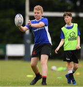 6 July 2021; Oisin Murphy, age 11, in action during a Bank of Ireland Leinster Rugby Summer Camp at Wexford Wanderers RFC in Wexford. Photo by Matt Browne/Sportsfile