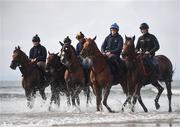 7 July 2021; Horses and riders, from left, Trading Point with Ciara Robinson, Stellify with Owen Moss, Current Option with Ian Brennan, Magnetic North with Tahdg McGuinness and Royal Admiral with Cian MacRedmond on the gallops at South Beach in Rush, Co. Dublin as trainer Ado McGuinness gears up for the iconic Galway Races Summer Festival that takes place from Monday 26th July to Sunday 1st August. Photo by David Fitzgerald/Sportsfile
