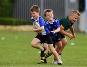 7 July 2021; Luke Farrell, aged 10, in action with Patrick Cheevers, aged 9, and Denis Gudziunas, aged 10, during a Bank of Ireland Leinster Rugby Summer Camp at Boyne RFC in Drogheda, Louth. Photo by Matt Browne/Sportsfile