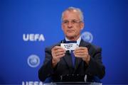 7 July 2021: UEFA Head of Youth and Futsal Competitions Claudio Negroni draws out the card of Blue Magic FC Dublin during the UEFA Futsal Champions League 2021/22 Preliminary Round draw at the UEFA headquarters, The House of European Football in Nyon, Switzerland. Photo by Valentin Flauraud / UEFA via Sportsfile