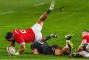 7 July 2021; Bundee Aki of British and Irish Lions is tackled by Thaakir Abrahams of Cell C Sharks during the 2021 British and Irish Lions tour match between Cell C Sharks and The British and Irish Lions at Emirates Airline Park in Johannesburg, South Africa. Photo by Sydney Seshibedi/Sportsfile