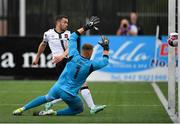 8 July 2021; Michael Duffy of Dundalk shoots to score his side's first goal, past Newtown goalkeeper Dave Jones, during the UEFA Europa Conference League first qualifying round first leg match between Dundalk and Newtown at Oriel Park in Dundalk, Louth. Photo by Seb Daly/Sportsfile