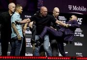 8 July 2021; Conor McGregor, right, and Dustin Poirier are kept apart by UFC President Dana White during a press conference ahead of UFC 264 at the T-Mobile Arena in Las Vegas, Nevada, USA. Photo by Thomas King/Sportsfile