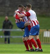 9 July 2021; William Armshaw of Treaty United, left, celebrates after scoring his side's first goal with team-mate Joe Collins and Sean Guerins during the SSE Airtricity League First Division match between Treaty United and Shelbourne at Markets Field in Limerick. Photo by Michael P Ryan/Sportsfile